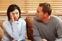 A couple talking with woman bored