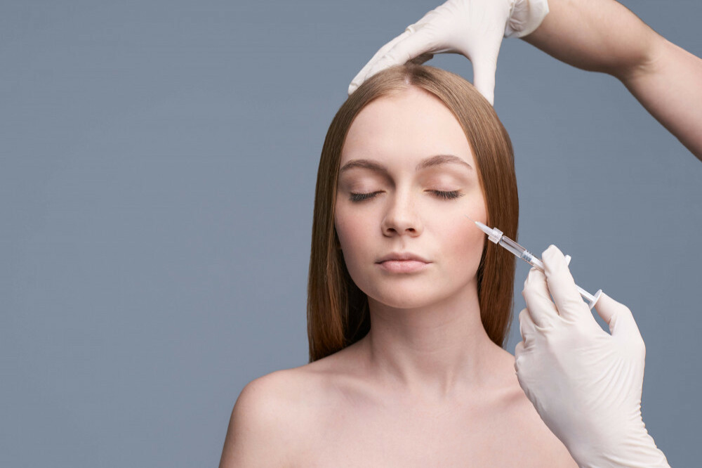 A woman getting a facial injection