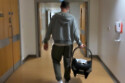 Anthony Quinlan carrying his newborn son out of hospital  / © Instagram