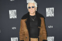 Baz Luhrmann won't be toning down his clothes as he gets older
