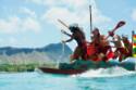 An outrigger canoe crew paddles in rhythm along Hawaii’s coastline to celebrate Prince Kūhiō Day. Credit: Paul Buijs/Pexels