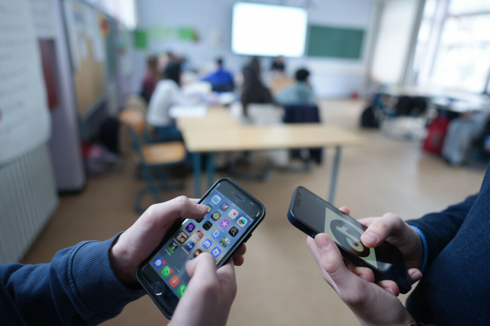Students using smartphones in schools